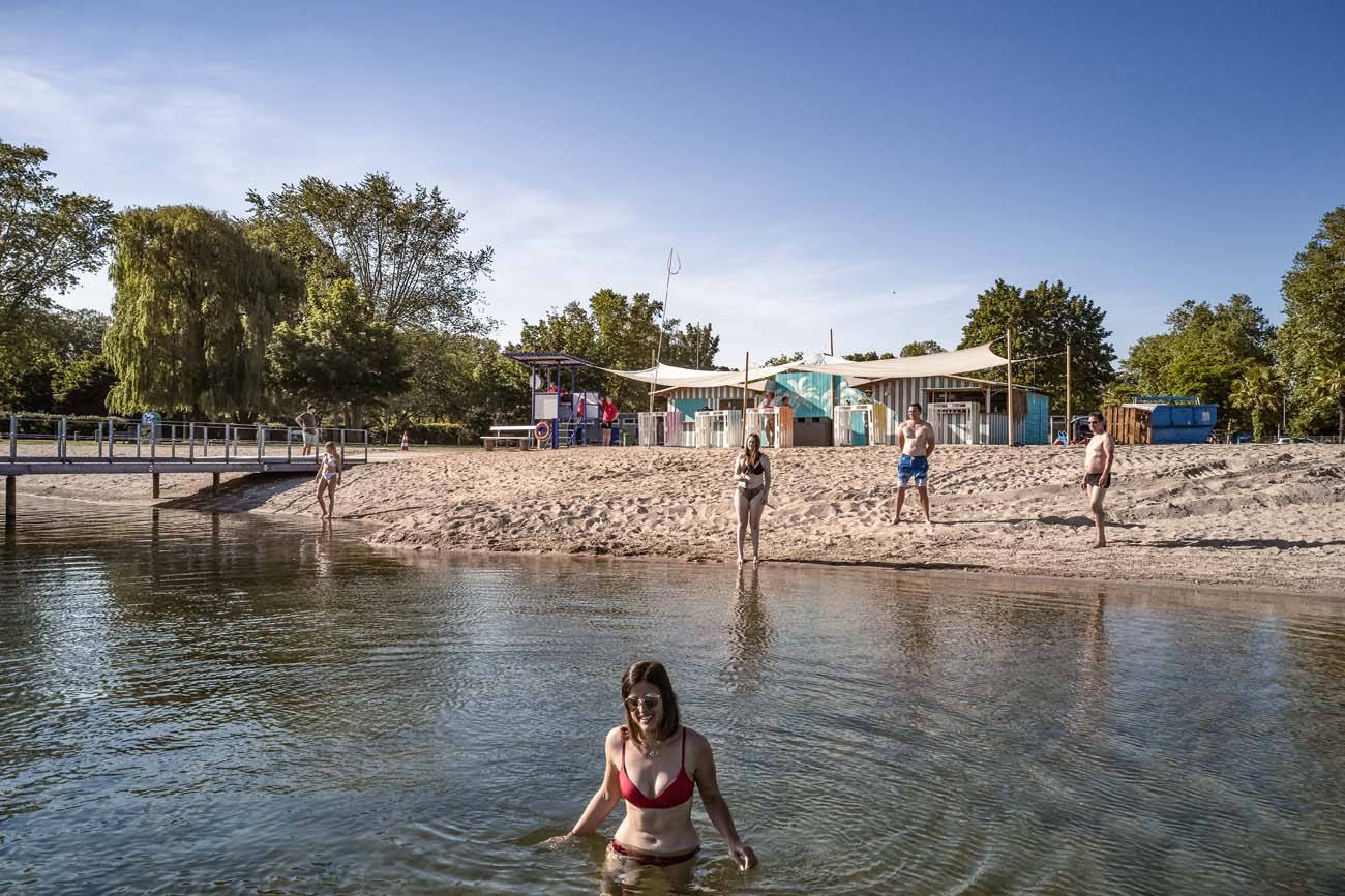 Woman in the water and people in the background
