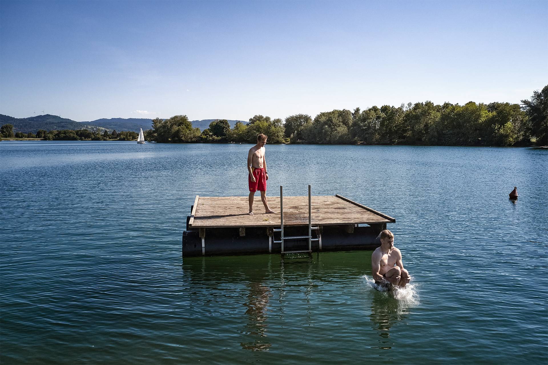 Man on a wooden island in the water